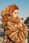 Fashion model winter woman in coat outdoors